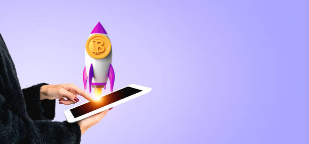 istock Woman finger touch tablet, rocket with bitcoin on copy space background 2128257259