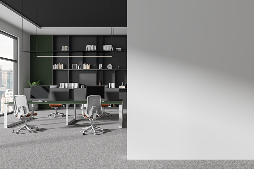 Interior of stylish open space office with green and white walls, carpeted floor, row of computer desks and copy space wall on the right. 3d rendering