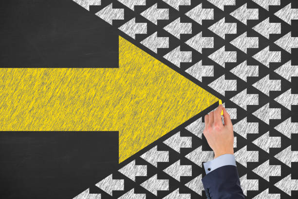 Going Your Own Way with Arrows Symbol on Blackboard Background