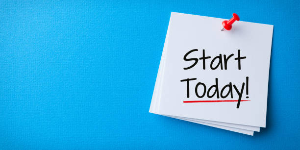 istock White Sticky Note With Start Today And Red Push Pin On Blue Cardboard 2128291637
