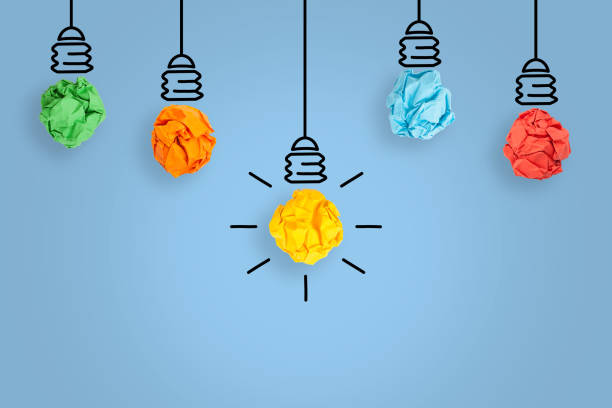 istock Creative Idea Concepts with Light Bulb Crumpled Paper on Blue Background 2128292719