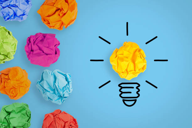 istock Creative Idea Concepts with Light Bulb Crumpled Paper on Blue Background 2128293240