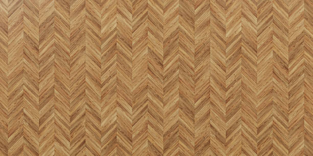 istock Seamless wood parquet texture herringbone light brown. 2128360505