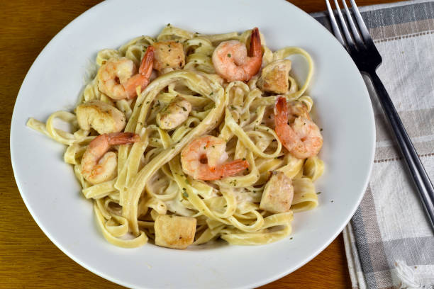 istock linguine alfredo top with  shrimp and chicken 2128363586