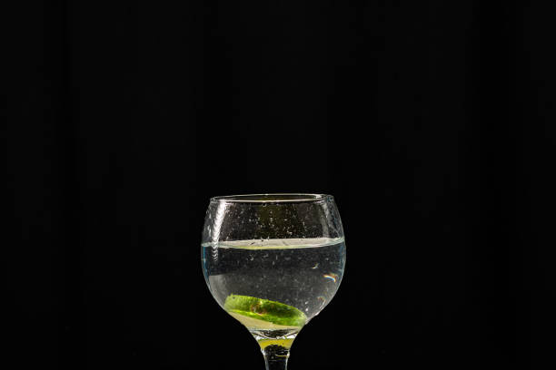 istock A glass bowl with water and lemon slices inside. 2128407750