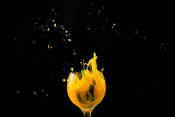 istock Splash in a glass goblet with orange juice inside. 2128407756