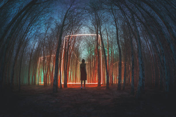 istock Woman walking in mysterious forest at night 2128413373