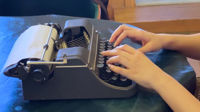 Woman hand at old retro typewriter. Business concepts
