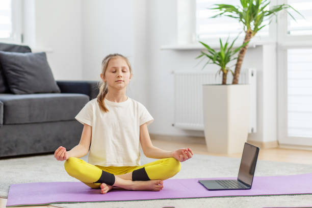istock Young Girl Meditating During Online Class 2128439514