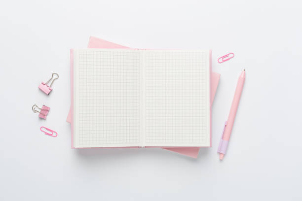 istock Notebook with stationery on color background, top view 2128446161