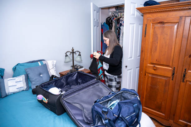 istock Mature woman selecting clothes 2128542281