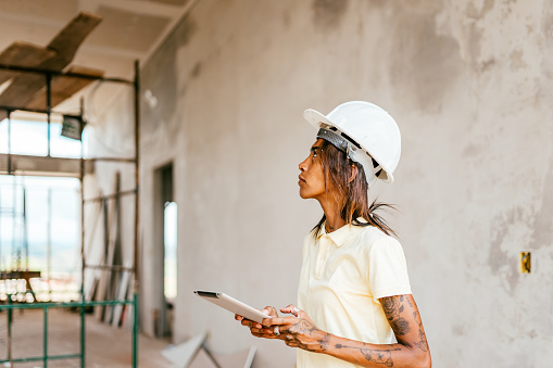 Female engineer inspecting a construction site