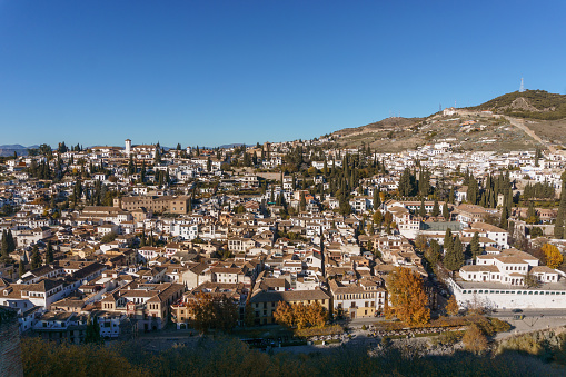 Landscape photo of the white houses moorish Albaicin district seen from the Alhambra, Granada, Andalusia, Spain