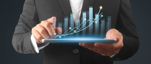 istock Businessman plan graph growth and increase of chart positive indicators,tablet in hand 2128592553
