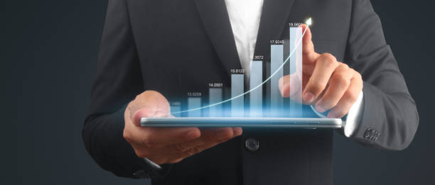 istock Businessman plan graph growth and increase of chart positive indicators,tablet in hand 2128592560