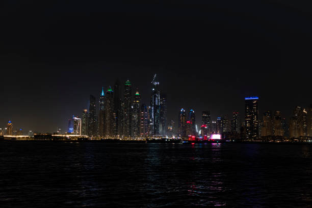istock City at night, panoramic scene of downtown reflected Dubai 2128664912