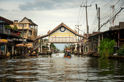 Famous floating market in Thailand, Damnoen Saduak floating market, tourists visiting by boat, Ratchaburi, Thailand. July 5, 2023