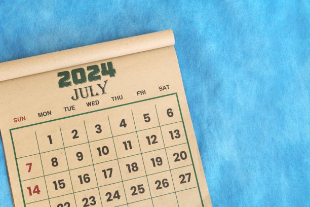 istock July 2024 calendar flat lay in blue background with copy space. 2128673467