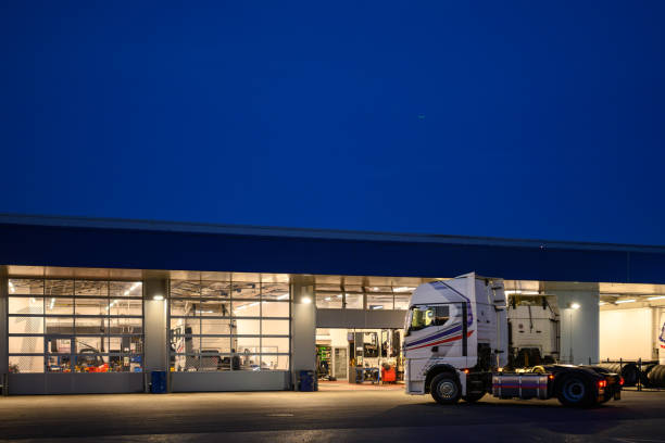 istock Garage for maintenance of trucks 2128680504