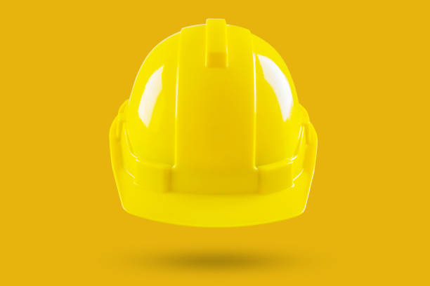 istock Safety construction helmet on yellow background 2128680526