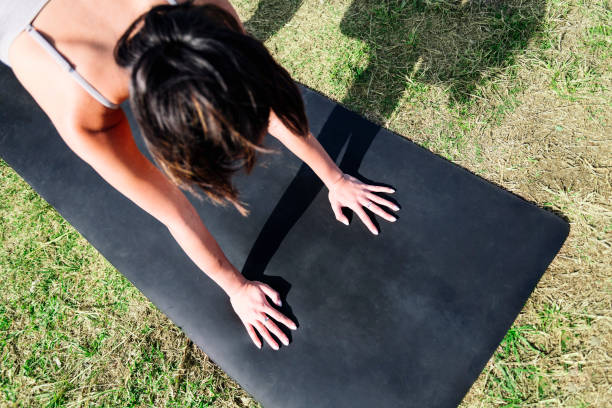 istock unrecognizable woman does yoga stretching exercise 2128681605