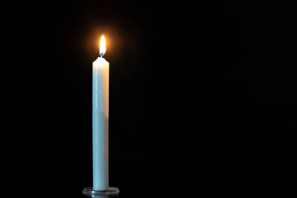 Candle soft glow and reflection on background. Candles with a soft, blurred focus, creating a serene and calming atmosphere