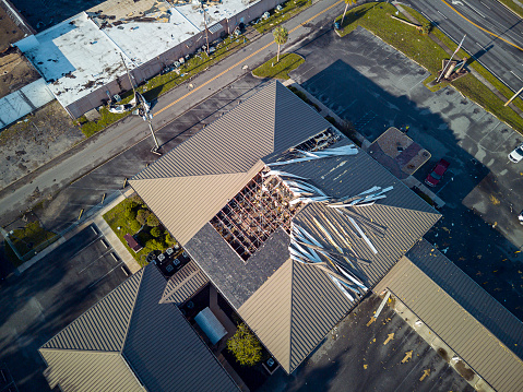 Municipal building roof obliterated: aftermath of hurricane fury in Perry, North Florida. Aerial view