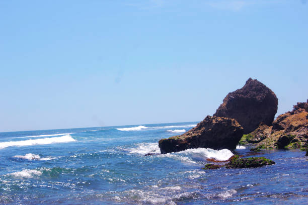 istock rock formation at the beach 2128823634
