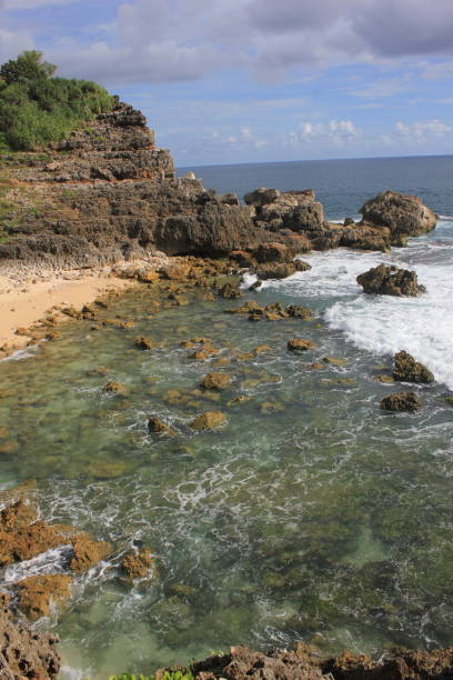 istock rock formation at the beach 2128854354