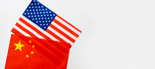 USA and China flags on white background.,Trade, investment, exports and imports of the United States and China.