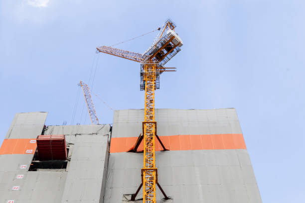 istock A large construction crane works on a high-rise building construction project. 2128864065