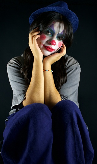 portrait of latina woman with clown face