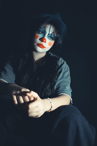 serious clown teen