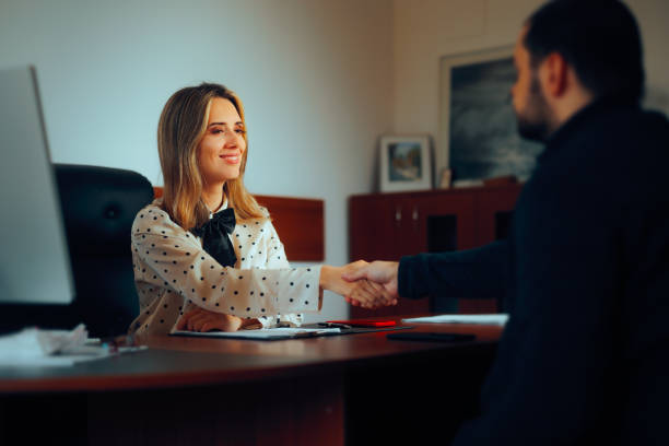 istock Business Manager Shaking Hands with Newly Hired Employee 2128998850