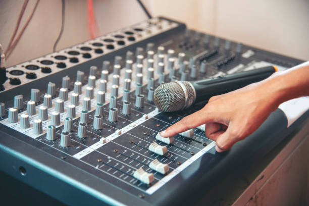 istock Production sound engineer hands working on recording studio mixing voice control. Expert adjusting volume equalizer voice, mixing console DJ sound engineering. Producer remix tune music sound record 2129008056