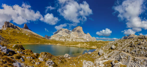 Dolomites, Dolomiti Alps in Italy beautiful mountain summer landscape with high rocky towers on the hiking route trekking. Mountain Dolomites photo panorama