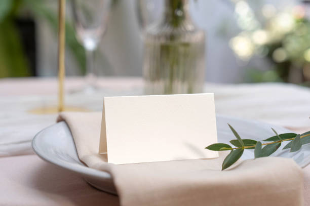 istock Mockup white blank space card, for Name place, Folded, greeting, invitation on wedding table setting background. 2129039649