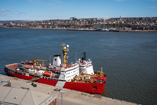Canadian coast guard ship at the St. Lawrence river pier in Quebec city during day of springtime