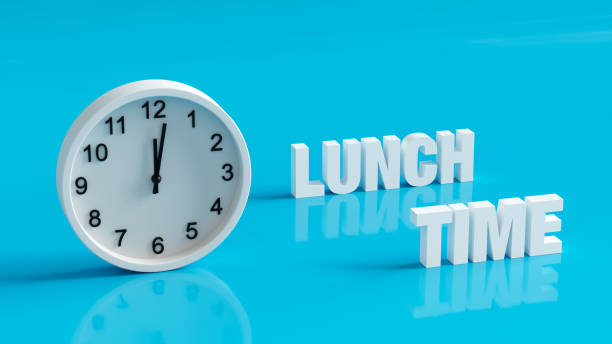 istock Lunch time break in office clock stock photo 2129143791