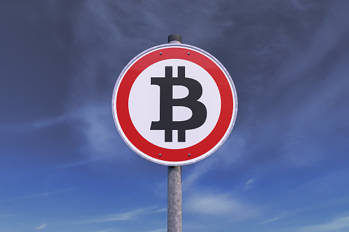 3d rendering of a traffic sign - ban for bitcoin. In the background a gray sky with clouds.