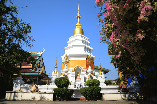 Ancient chedi pagoda or antique old stupa for thai people travelers travel visit and respect praying blessing wish relic of Buddha mystery of Wat Ming Muang temple at Chiangrai in Chiang Rai, Thailand