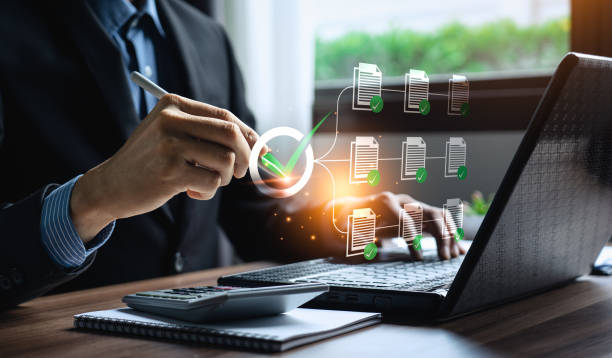 istock Business performance checklist, businessman using laptop doing online checklist survey, Check marks on checklist and Filling online form or answering questions. evaluation, online survey, online exam. 2129207280