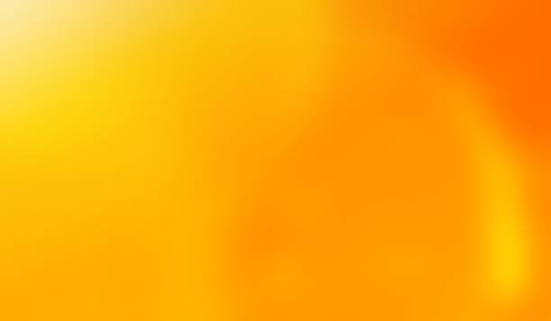 istock abstract orange golden glowing background 2129219576