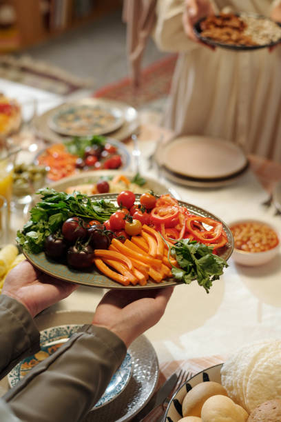 istock Unrecognizable Muslim Women Setting Table For Uraza Bayram 2129242127