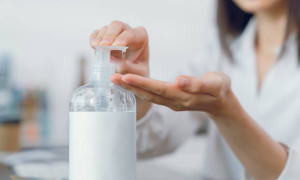 istock Hand using alcohol wash gel for cleaning sanitizer. 2129270082