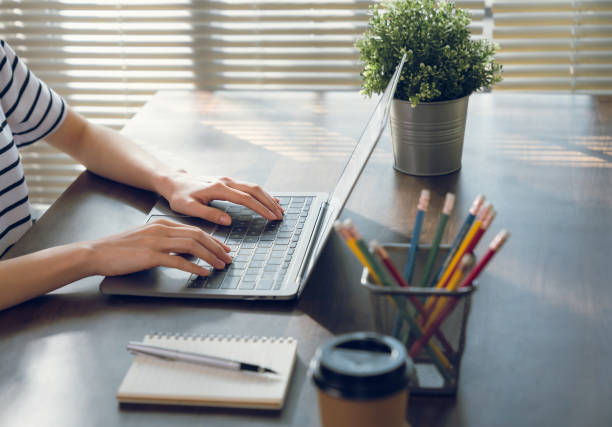 istock Businesswoman working on laptop with type a message on the keyboard. 2129270610