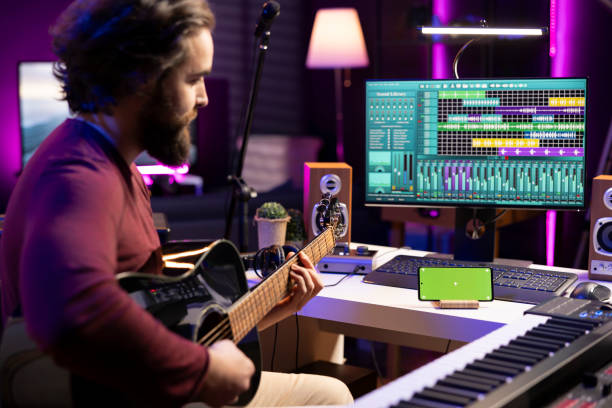 istock Young artist playing acoustic instrument accords in home studio 2129283100