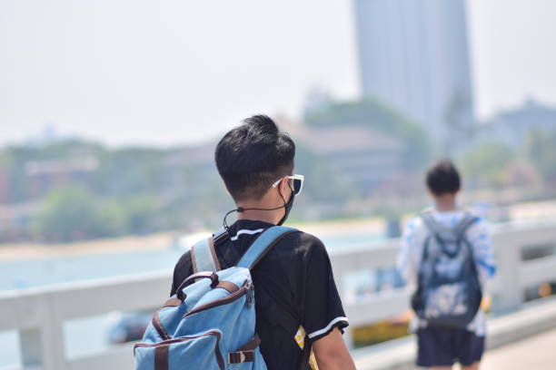 istock A male tourist is traveling with a backpack. 2129286191