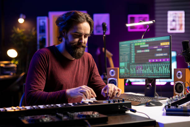 istock Singer playing electronic piano keyboard and recording audio files 2129287274