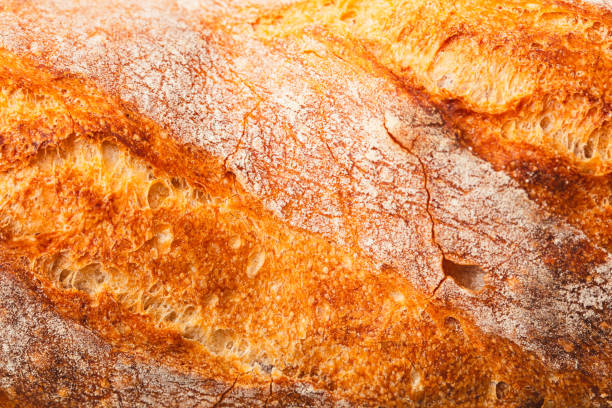istock Ruddy crust of bread as an abstract background. Texture 2129288305